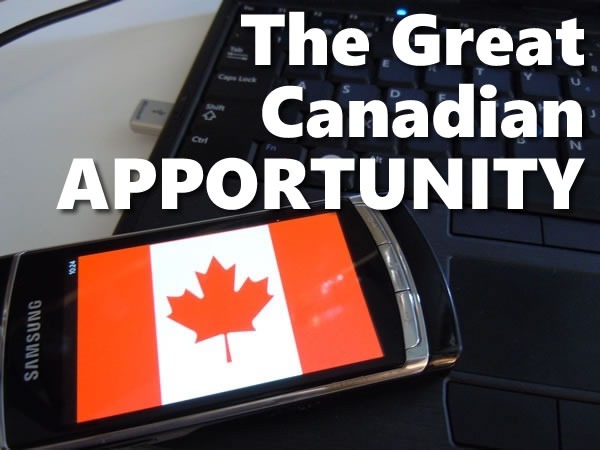The Great Canadian Apportunity: photo of a Windows Phone displaying a Canadian flag, leaning against a windows laptop