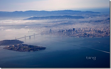 Aerial view of Yerba Buena and Treasure islands, Oakland Bay Bridge, and San Francisco, California .