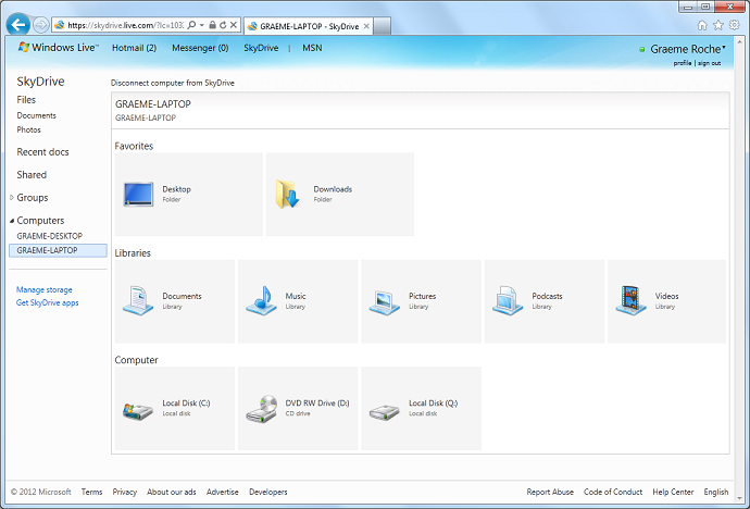 Снимок экрана веб-сайта SkyDrive, на котором показан доступ к 2 компьютерам: настольному компьютеру Graeme и ноутбуку Graeme. Все библиотеки, папки и диски отображаются для выбранного компьютера, к которому пользователь получает удаленный доступ.