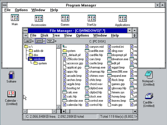 바탕 화면의 여러 아이콘 위에 떠 있는 프로그램 관리자 및 파일 관리자 창