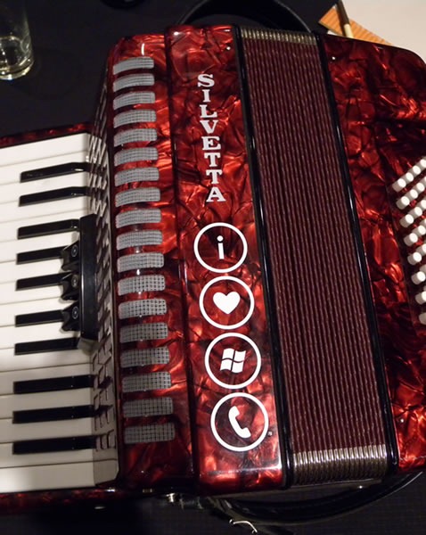 Red Silvetta piano accordion with "I Love Windows Phone" sticker