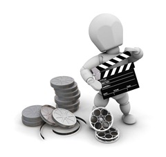 Clipart Illustration of a White Character Holding A Clapper And Standing With Film Reels At His Feet