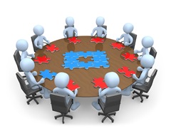 Group Of Light Blue People Holding A Meeting And Trying To Solve A Jigsaw Around A Large Rectangular Conference Table In An Office Clipart Illustration Image