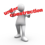 Clipart Illustration of a White Person Holding Red Text Reading Under Construction