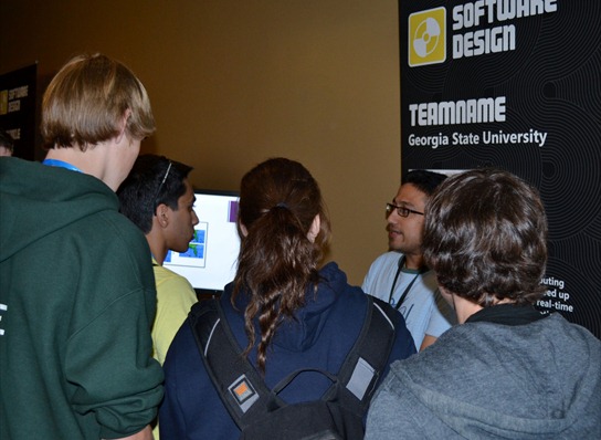 Students listen to a demonstration from a member of Teamname at the U.S. Imagine Cup Finals on April 23, 2012.